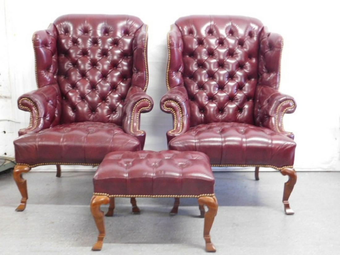 Pr Queen Anne Style Wing Chairs w/Ottoman: Pair Queen Anne Style Wing Chairs with Ottoman by Leathercroft Inc., Cordovan tufted leather with brass tacking, mahogany legs, 20th C, 45"h. CONDITION: Very fine.