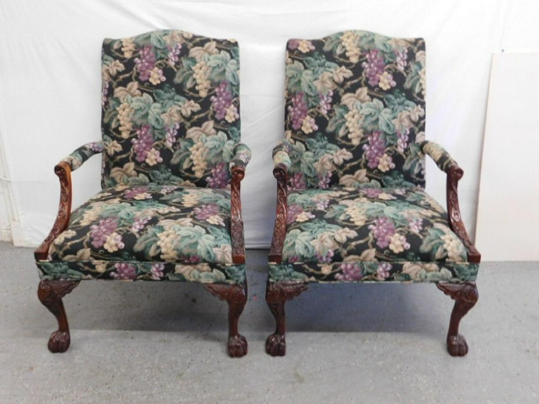 Pr Chippendale Style Library Chairs: Pair Chippendale Style Library Chairs, mahogany, open arms, grape cluster pattern tapestry type upholstery, carved arm supports and cabriole legs with hairy claw feet, early to mid 20th C., 46"h. COND
