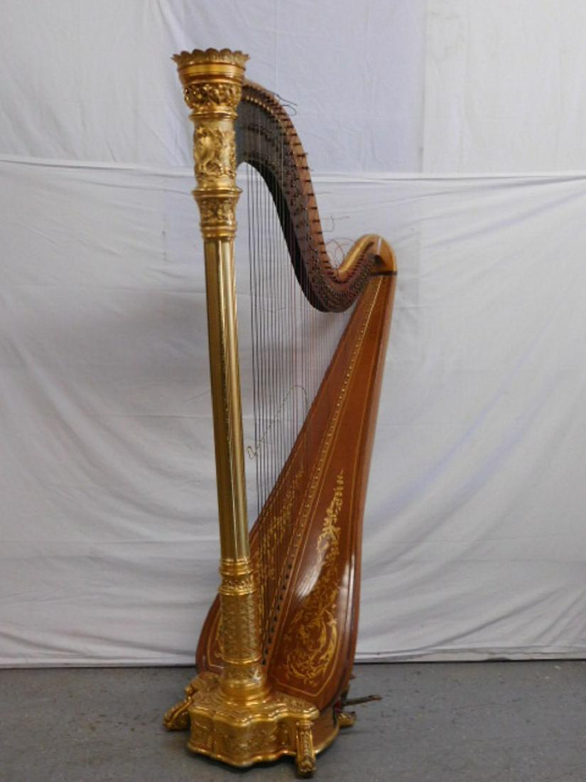 Lyon & Healy Harp: Lyon & Healy Harp, No. 2332, seven pedals, spruce and maple with foliate scroll gilt stenciling and a gilt elaborately carved crown and floral crested round paneled column with conforming scroll foote