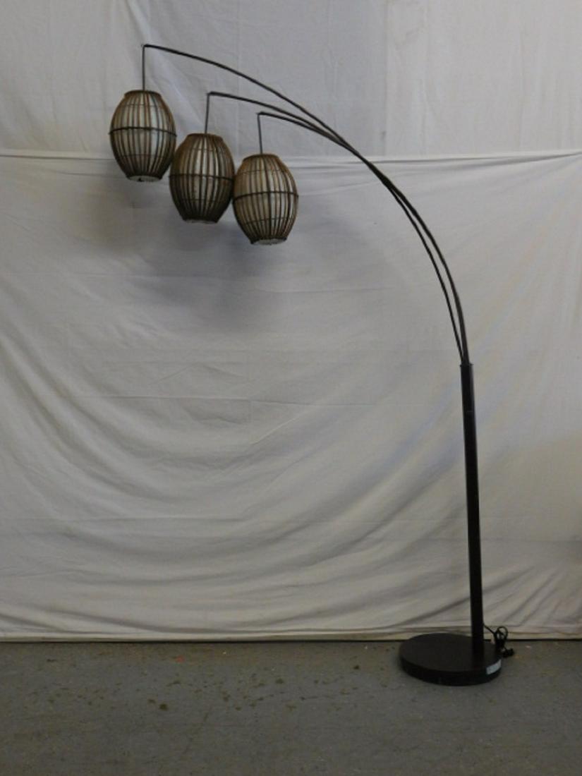 Arc Lamp: Arc Lamp by H. Welldone, brown metal finish base, triple arms with three bambo lantern form pendant shades, late 20th C, 75"h. CONDITION: Very good, slight finish loss on edge of circular base.