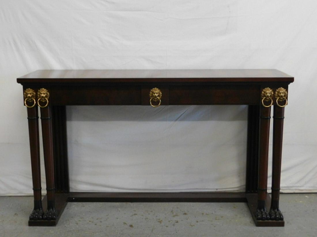 French Empire Style Console Table: French Empire Style Console Table banded mahogany with line inlay, four brass lion mask and ring mounts, turned front columns on claw feet, late 20th C, 34" x 18" x 60". CONDITION: Very good, minor sc