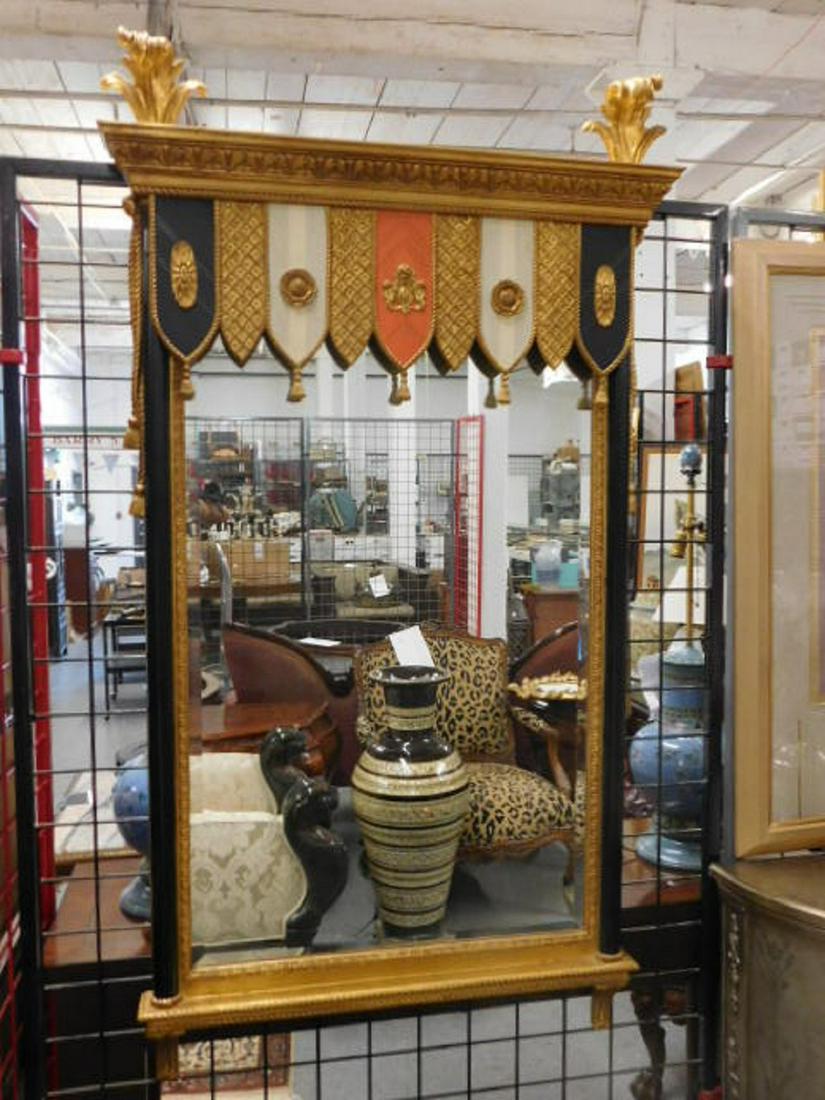 Neo Classical Style Wall Mirror: Neo Classical Style Wall Mirror, "Heraldic Pavillion" by Carvers' Guild, black and gold with polychrome over wood, plume, drape, tassel and rosette carvings, 20th C, 64" x 36". CONDITION: Very fine.