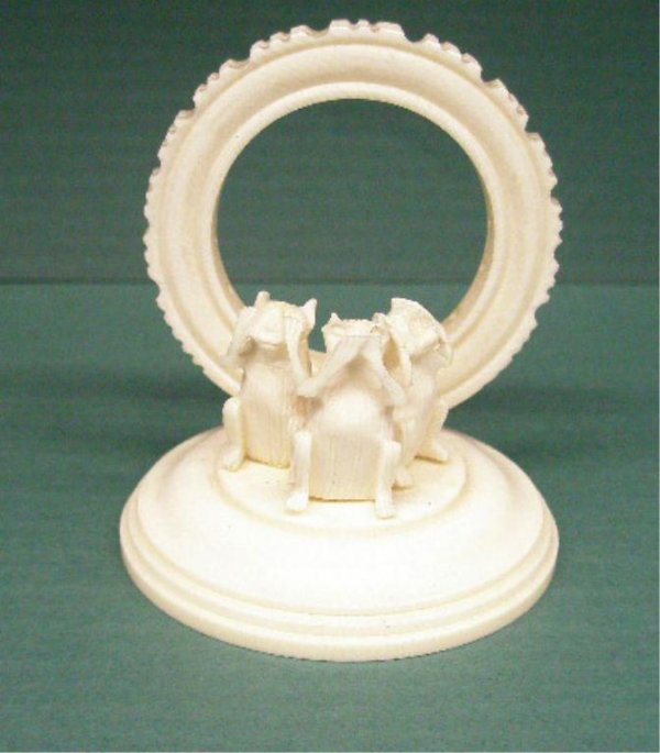 Ivory Toothpick Holder: Ivory toothpick holder, 3 carved monkeys sit before a ring with holes to accommodate tooth picks, hgt 2 1/4", diam 2"...NO INTERNATIONAL SHIPPING...