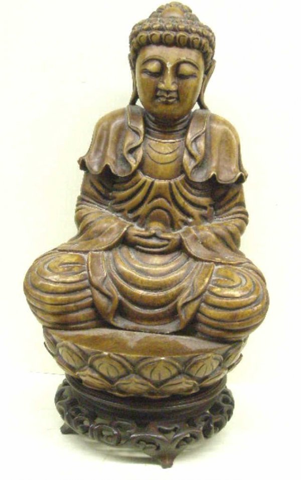 Oriental Soapstone Seated Buddha: Oriental soapstone seated Buddha holding a ball, lotus base, tea stained stone, hgt 9", L 6 1/2", late 19th C
