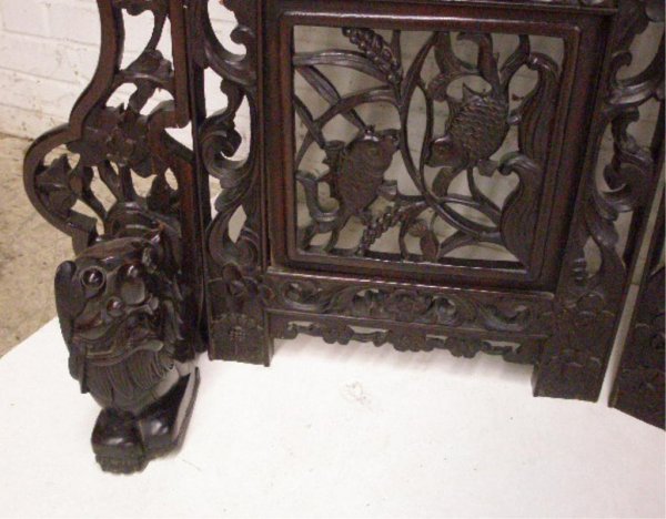 Chinese 4 Part Dressing Screen: Chinese 4 part dressing screen, rosewood, features pierced carved dragons & scrolls, mother of pearl inlaid figural landscape panels, and sculptured Foo dog end base supports, L 79", H 66", early to m