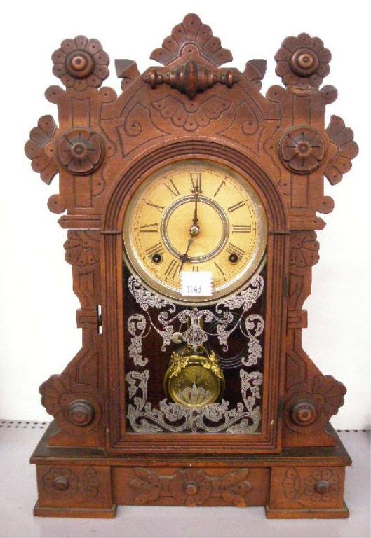 William L. Gilbert Gingerbread Shelf Clock: William L. Gilbert walnut cased 20" gingerbread shelf clock, paper face, time & strike movement, stenciled glass door face