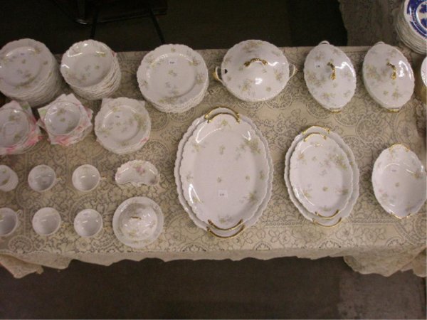 Theodore Haviland Limoges China Set: Theodore Haviland Limoges floral decorated 90 piece china set, (7) 9 1/2" dinner plates, (12) 8 1/2" luncheon plates, (6) 7 1/2" salad plates, (12) 5" berry bowls, (12) 7" soup bowls, (10) butter pats