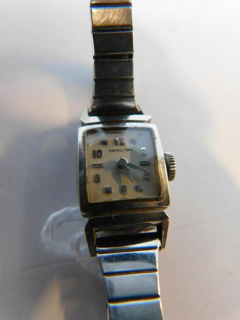 Hamilton 14k Gold Lady's Wrist Watch: Hamilton 14k white Gold lady's Wrist Watch, 22 jewels adjusted movement model 757; Seidel stretch band. CONDITION: Very good, winds but starts and stops.