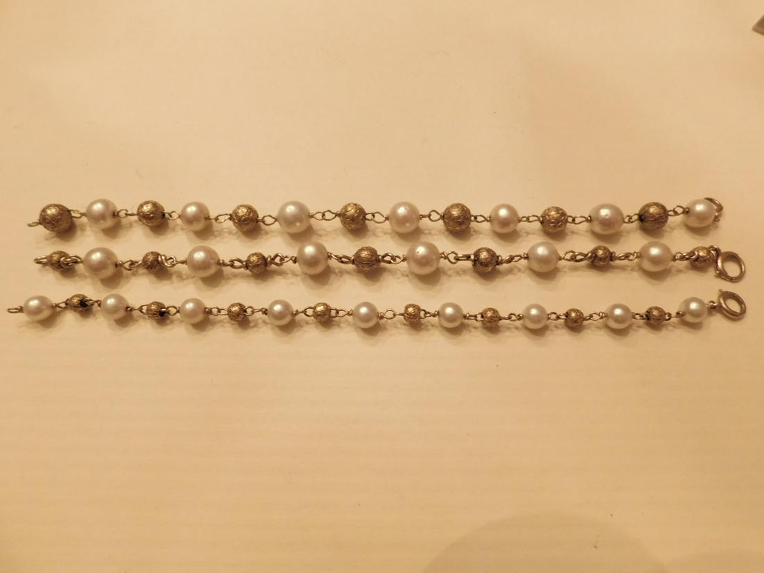 Three 14k YG Bead and Pearl Bracelets: Three 14k YG Bead and Pearl Bracelets, assorted 6mm - 8mm pearls and wired embellished gold beads, 7" length. Total 14.9 DWT.[22] CONDITION: Very fine vintage.