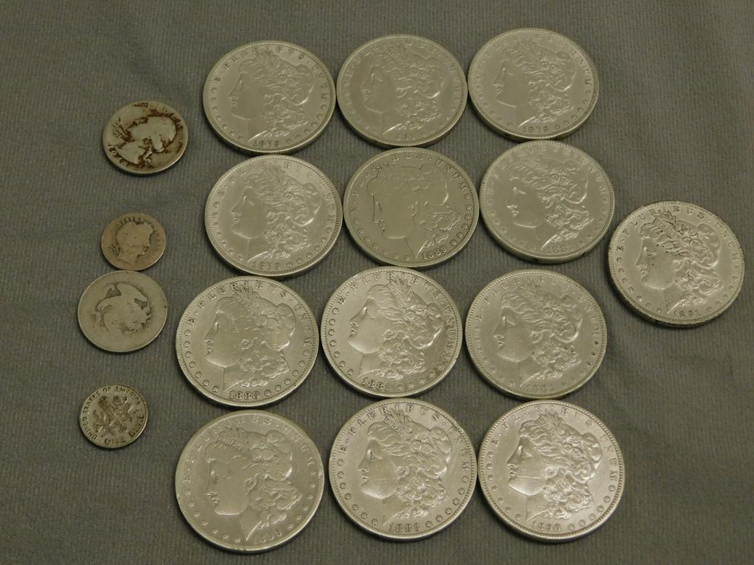 Silver Coins $13.70 Face Value: Silver Coins $13.70 Face Value, (a) thirteen Morgan Dollars with residue on reverse; (b) two quarters; (c) two dimes. CONDITION: Some residue on reverse of Morgan dollars.