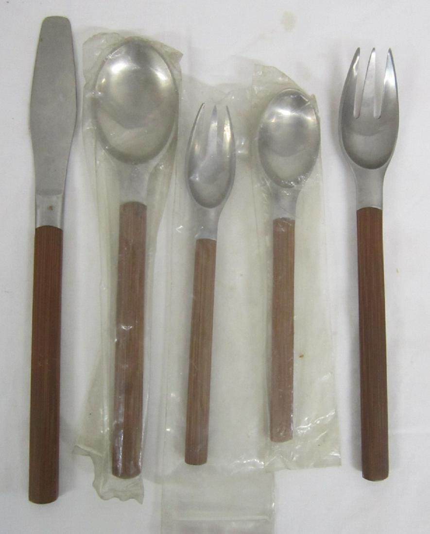 Dansk Teak Handle Place Setting: Dansk Teak Handle Place Setting, flat teak handles, five piece place setting: knife,dinner fork, luncheon fork, soup spoon and teaspoon. CONDITION: Vintage, new to like new.