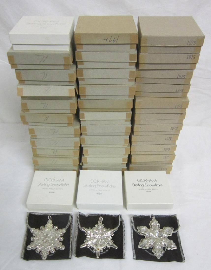 36 Gorham Sterling Snowflakes: Thirty-six Gorham Sterling Snowflakes, limited annual edition, twelve each for years 1971, 1972 and 1975, each in original boxes and felt pouches. CONDITION: Like new, 1971 missing 2 outer cardboard b