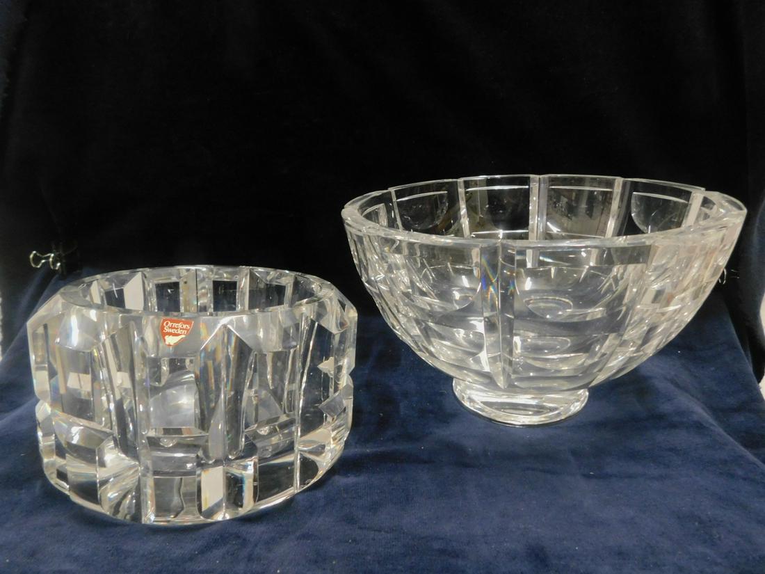 2 Orrefors Bowls: Two Orrefors Bowls, clear glass, includes: Simon Gate design faceted free forms 5 1/2"h, 8 1/2"d, and block paneled 4"h, 6 1/2"d, both with original labels, 20th C. CONDITION: Very fine, no issues ide