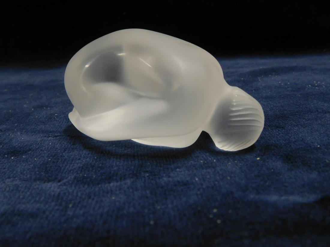 Lalique Nu Feuille Plie: Lalique Nu Feuille Plie, No. 1191900, frosted glass female nude, approx. 3"l. CONDITION: Like new in box, interior gray cardboard holder in box is ripped.