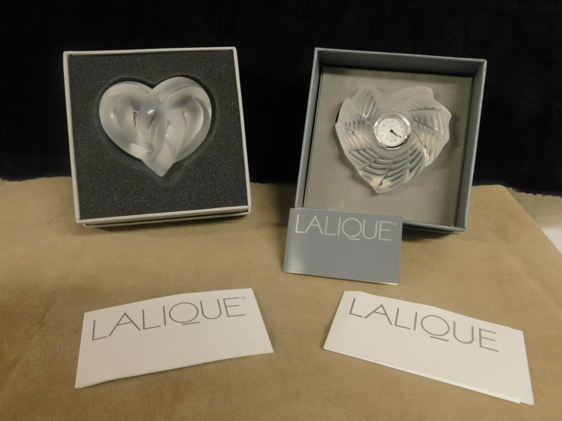 Lalique Clock & Paperweight: Lalique Clock and Paperweight includes: Valentine clock No. 1085600 and Hearts paperweight No. 1184700. CONDITION: Both vintage new in boxes.