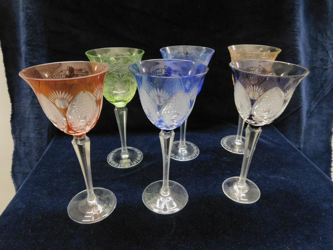 6 Colored Crystal Wine Goblets: Six Colored Crystal Wine Goblets includes: three different color pineapple pattern cut to clear with notched stems; and three different color stag, bird and flower intaglio etched to clear with disk e