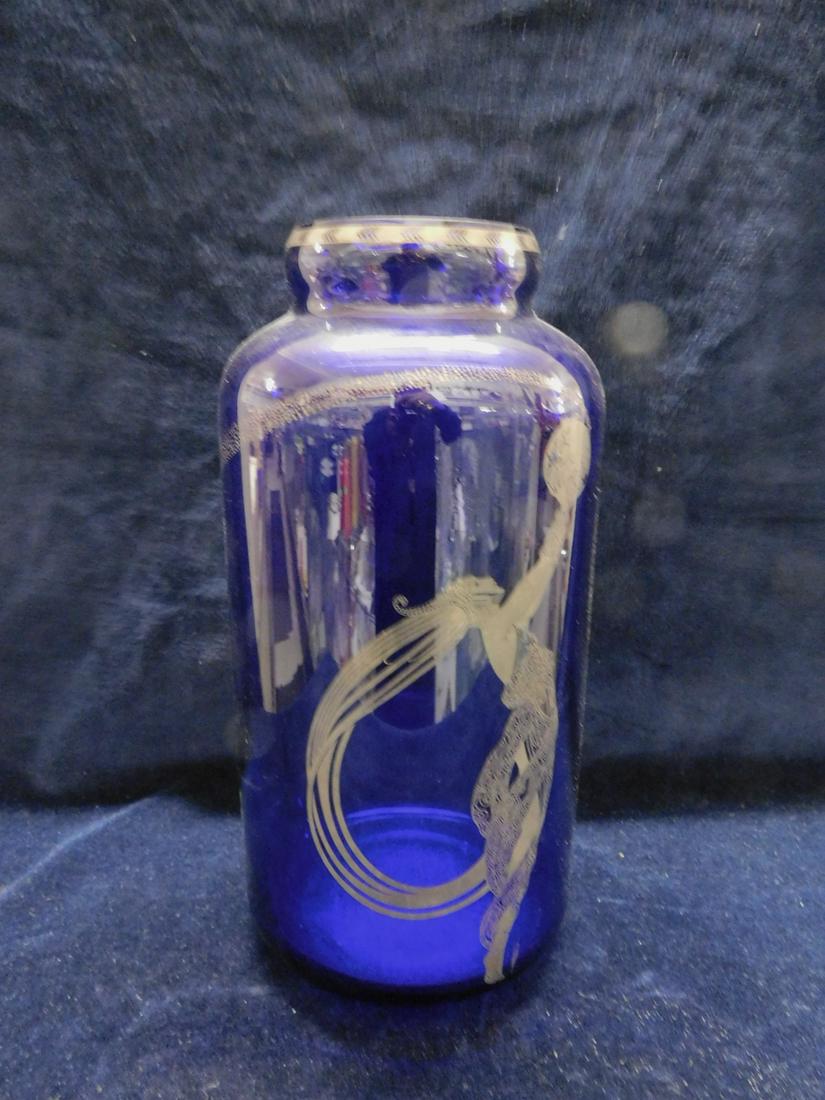 Erte Cobalt Glass Vase: Erte Cobalt Glass Vase "Fireflies", cylindrical form with silver resist figure and borders, 10"h, 20th C. CONDITION: Very fine condition.