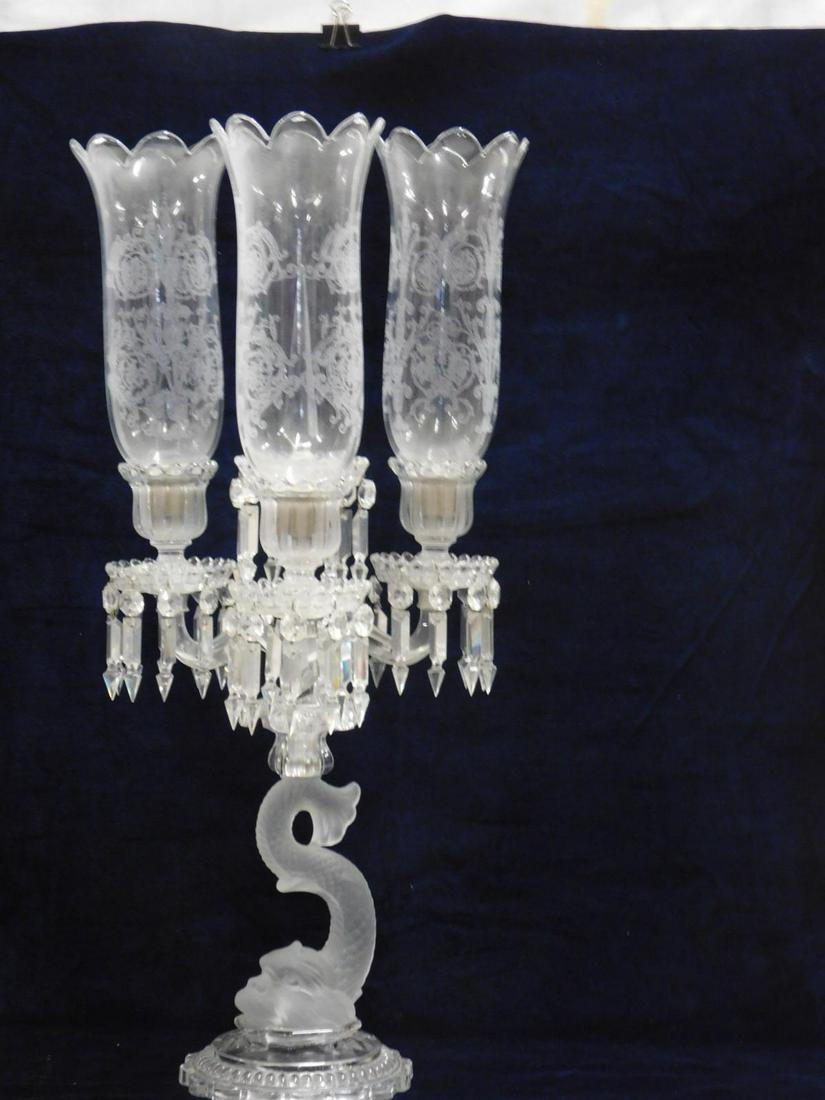 Baccarat Dolphin Crystal 3 Light Candelabra: Baccarat Dolphin Crystal three Light Candelabra, frosted glass dolphin with clear molded glass base and fittings, cut crystal spears, etched glass hurricane shades, 20th c. 27 1/2"h, 12"d. CONDITION: 
