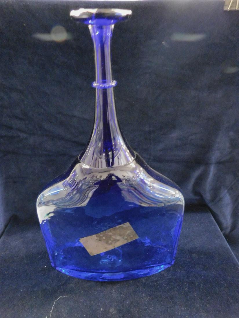 Kosta Boda Satellite Bottle: Kosta Boda Satellite Bottle, Sweden, cobalt blue with antiqued rectangular panel, 17"h, model 7080706, with original box. CONDITION: Like new, mold imperfection line at base of neck.
