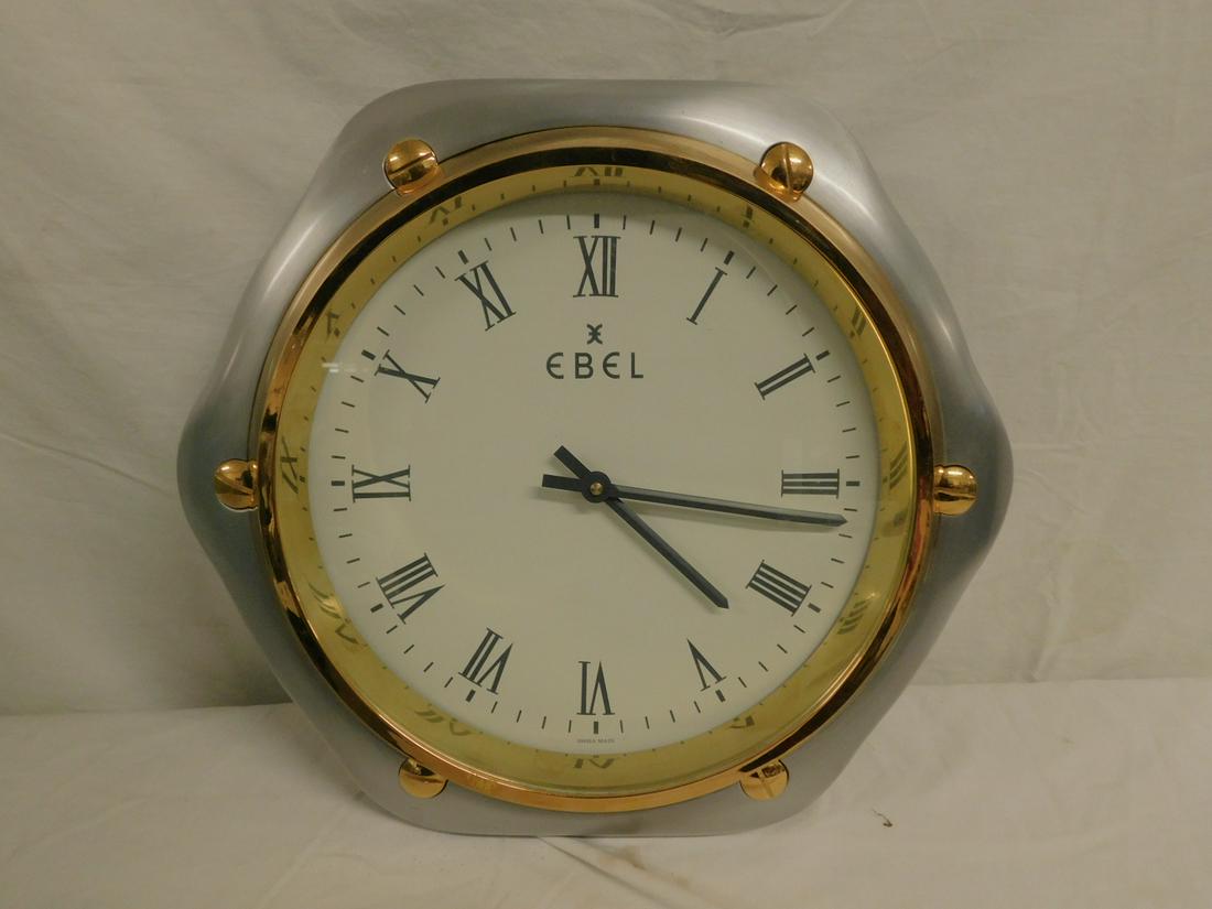 Ebel Store Clock: Ebel Store Clock, hexagonal heavy brushed aluminum case with large gold plated screwed down bezel; Swiss made, W. Germany quartz movement; 17"d, 4 1/2"w. CONDITION: Very good, mild usage, currently ru