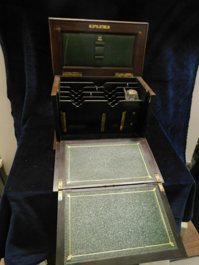 English Traveling Lap Desk / Letter Box: English Traveling Lap Desk / Letter Box, mahogany with scroll, ribbon and floral inlays; arched hinged top, drop front with fold out tooled green leather writing surface, fitted interior of letter slo