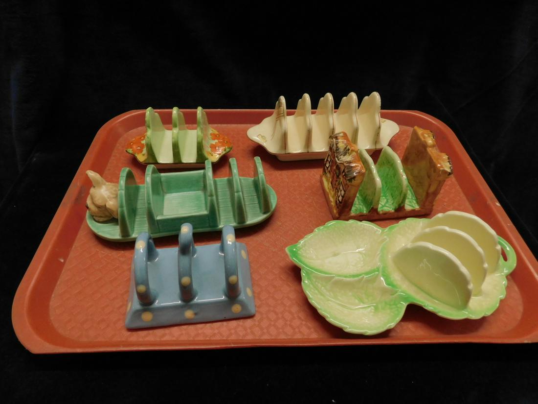 6 Assorted English Toast Holder: Six Assorted English Toast Holder, three and four slice including: Tockmy, blue with white dots; two Sylvac, leaf form and wood form with dog head at end, Price Bros. Cottage ware, Rubian Art Grimwade
