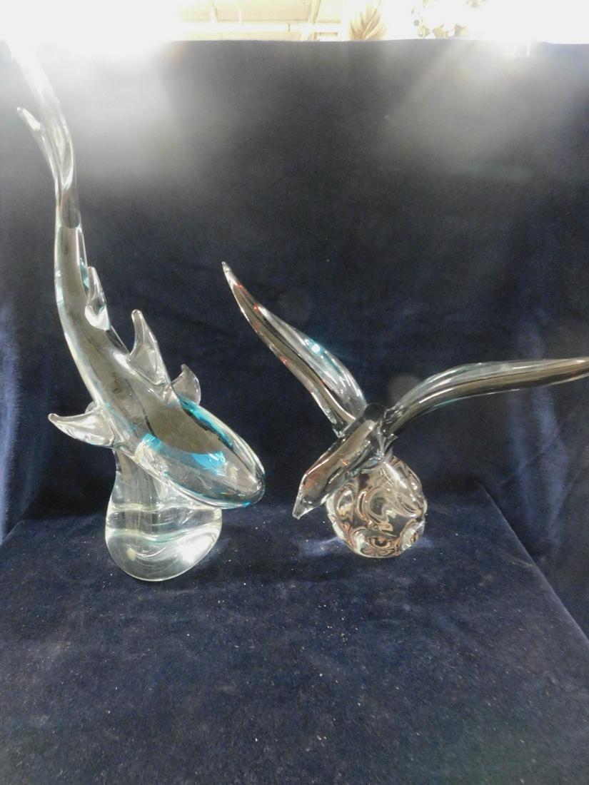 2 F.M. Konstglas Sweden Glass Sculptures: Two F.M. Konstglas Sweden Glass Sculptures, both signed "Ronneby", clear to colored glass, includes: 18" h x 11"l dolphin; and a 14 1/2" l x 10 1/2"h spread wing bird. CONDITION: Very fine, no issues 