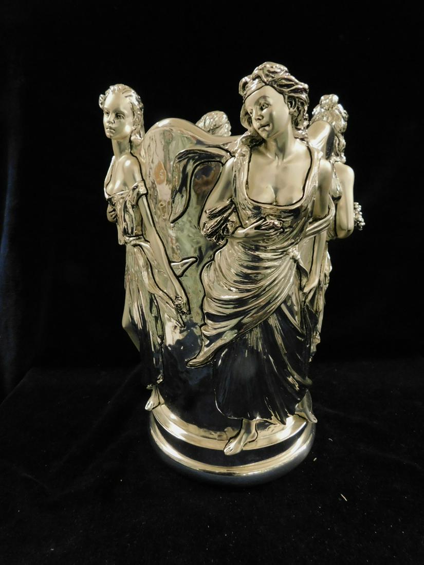 Au Courant Marcello Georgio Vase: Au Courant Marcello Georgio Vase, laminated silver finish metal with four partially sculptured standing maidens holding fruits and flowers, includes: clear glass removable liner, made in Italy, 20th C