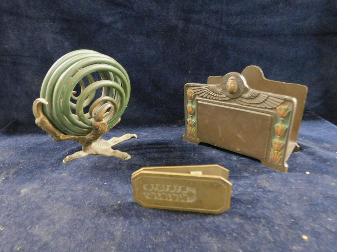 Art Deco Desk Accessories: Art Deco Desk Accessories includes: Egyptian Revival style letter holder in bronze finished iron; a painted and gilt bronze ring form paper holder on eagle claw base, and a brass paper clip, early 20t