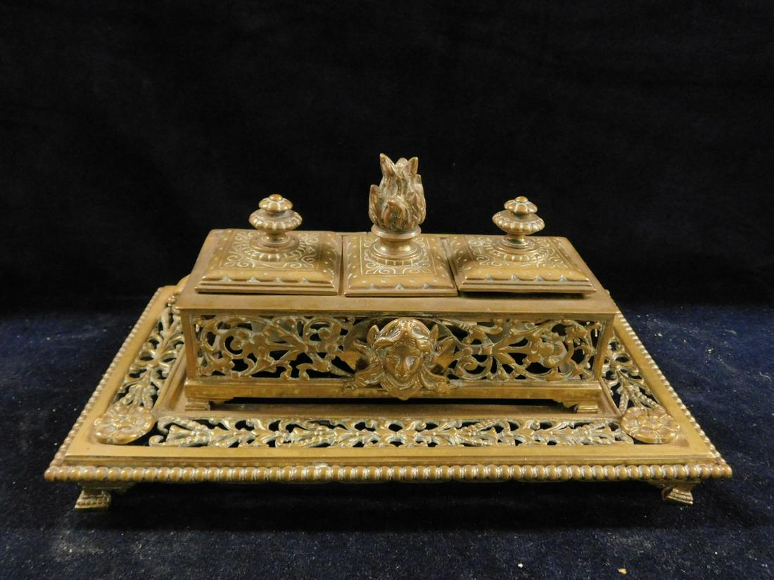 Renaissance Revival Ink Stand: Renaissance Revival Ink Stand, brass, triple lidded box with urn and flame finials, open work scroll body, Medusa and lion mask mounts, rests upon a conforming bead edge platform base, 19th c, 11" x 6