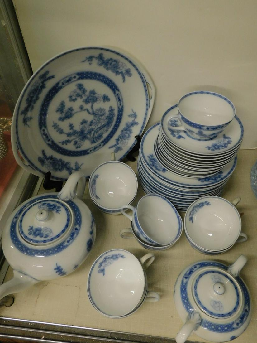 Rosenthal Partial Dinnerware Set: Rosenthal Partial Dinnerware Set, Donatello, Serb-Bavaria, blue and white with center Oriental tree including: 12" double handled platter, teapot, sugar, twelve luncheon plates, nine cups / twelve sau
