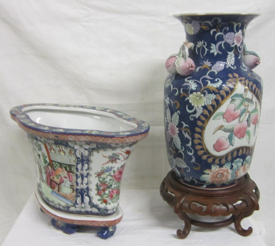 2 Chinese Famille bleu Porcelain Pcs: Two Chinese Famille bleu Porcelain Pieces includes: longine form jardinere on fitted porcelain stand 14" x 10 14", vase with sculptured fruit handles and footed rosewood stand, late 20th C. CONDITION:
