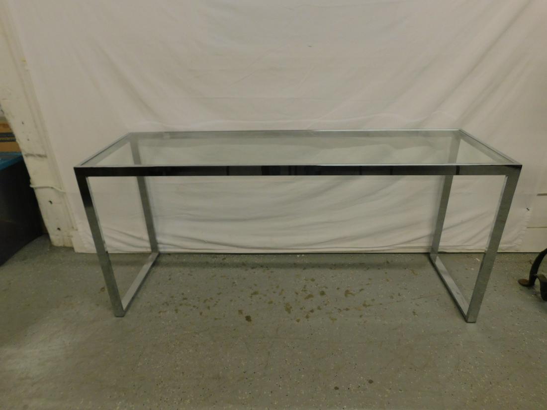 Modern Era Sofa Table: Modern Era Sofa Table, chromed flat rod construction, inset plate glass top, late 20th c. 19" x 60" x 27" h. Condition: Very good, chip on one corner of glass.