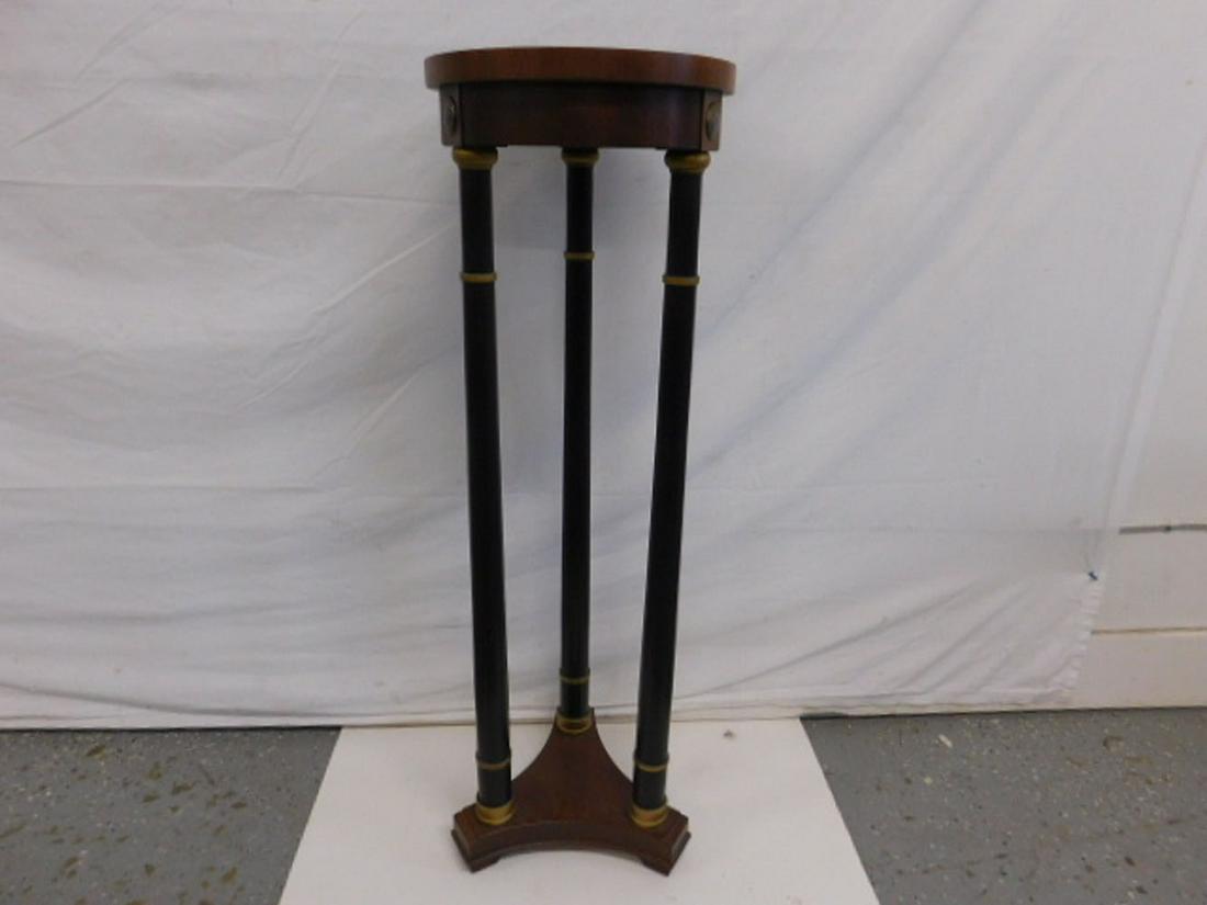 Federal Style Plant Pedestal: Federal Style Plant Pedestal, mahogany and ebonized wood with gilt highlights, 12" d top, supported by three cylindrical columns on platform base, mid 20th C, 37 3/4"h. CONDITION: Very good, modest us