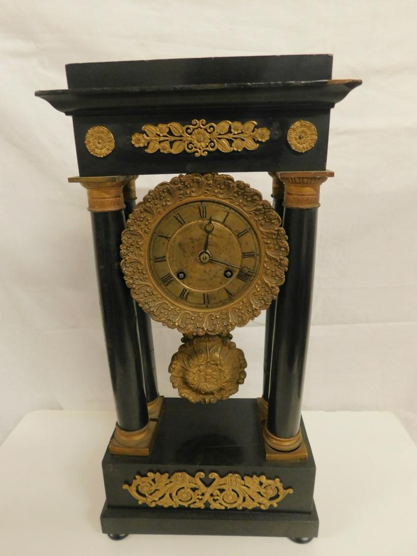 French Empire Mantel Clock: French Empire Mantel Clock, J. Charles A. Paris brass time and strike movement, black lacquered case with Dore brass mounts, capitals, dial and swan cast pendulum; 19 1/2"h, 19th c. CONDITION: Tarnish