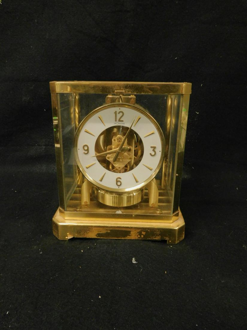 Le Coultre Atmos Clock: Le Coultre Atmos Clock, brass and glass, fifteen jewel unadjusted movement, 8 1/4" x 6 1/4" x 9 1/2". CONDITION: Running condition unknown, areas of finish wear on brass frame.