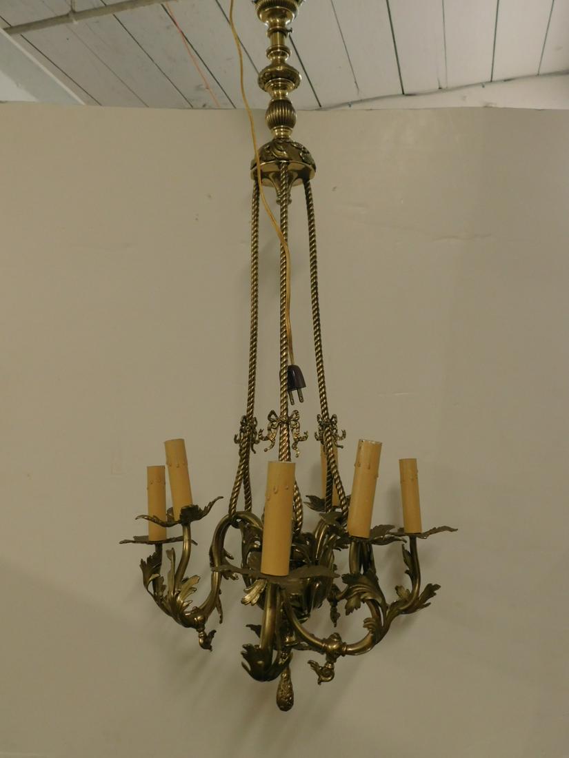 French Rococo Style Gas Chandelier: French Rococo Style Gas Chandelier , brass, overall acanthus leaf castings, brass rope support rods, six shaped arms, now electrified, 19th / 20th C, 15"d, 40"l. CONDITION: Very good.