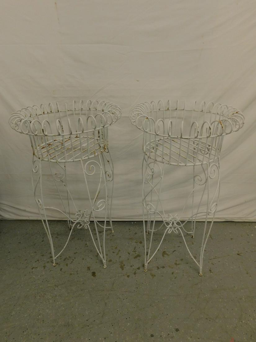 Pr Bent Rod Plant Stands: Pair of Bent Rod Plant Stands, white painted scrolled metal rod construction, mid 20th C, 37"h, 23"d. CONDITION: Areas of paint loss and rust.