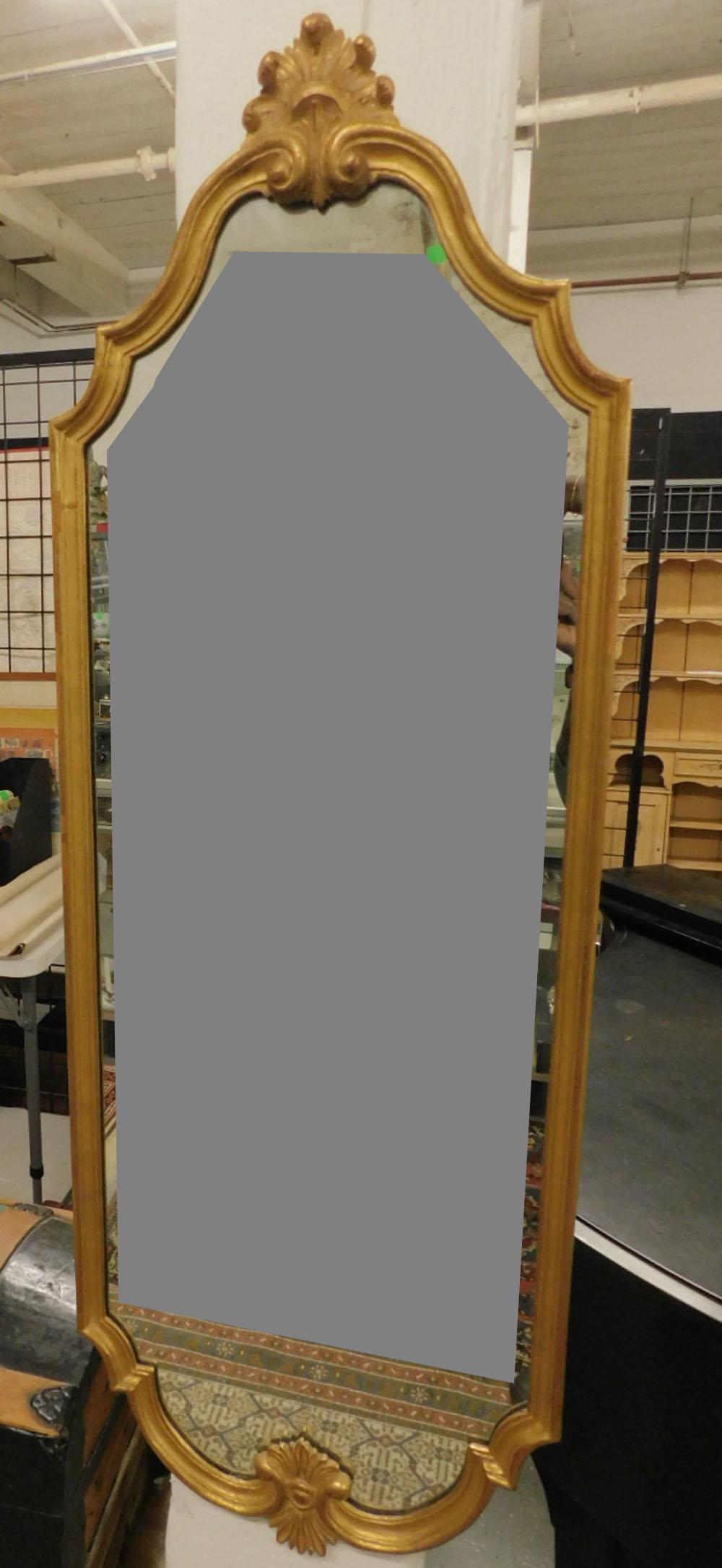 Baroque Style Gilt Wall Mirror: Baroque Style Gilt Wall Mirror, distressed gilt wood frame with acanthus carved serpentine crest, 20th C, 17 1/2" x 75". CONDITION: Very good, light gilt wear.