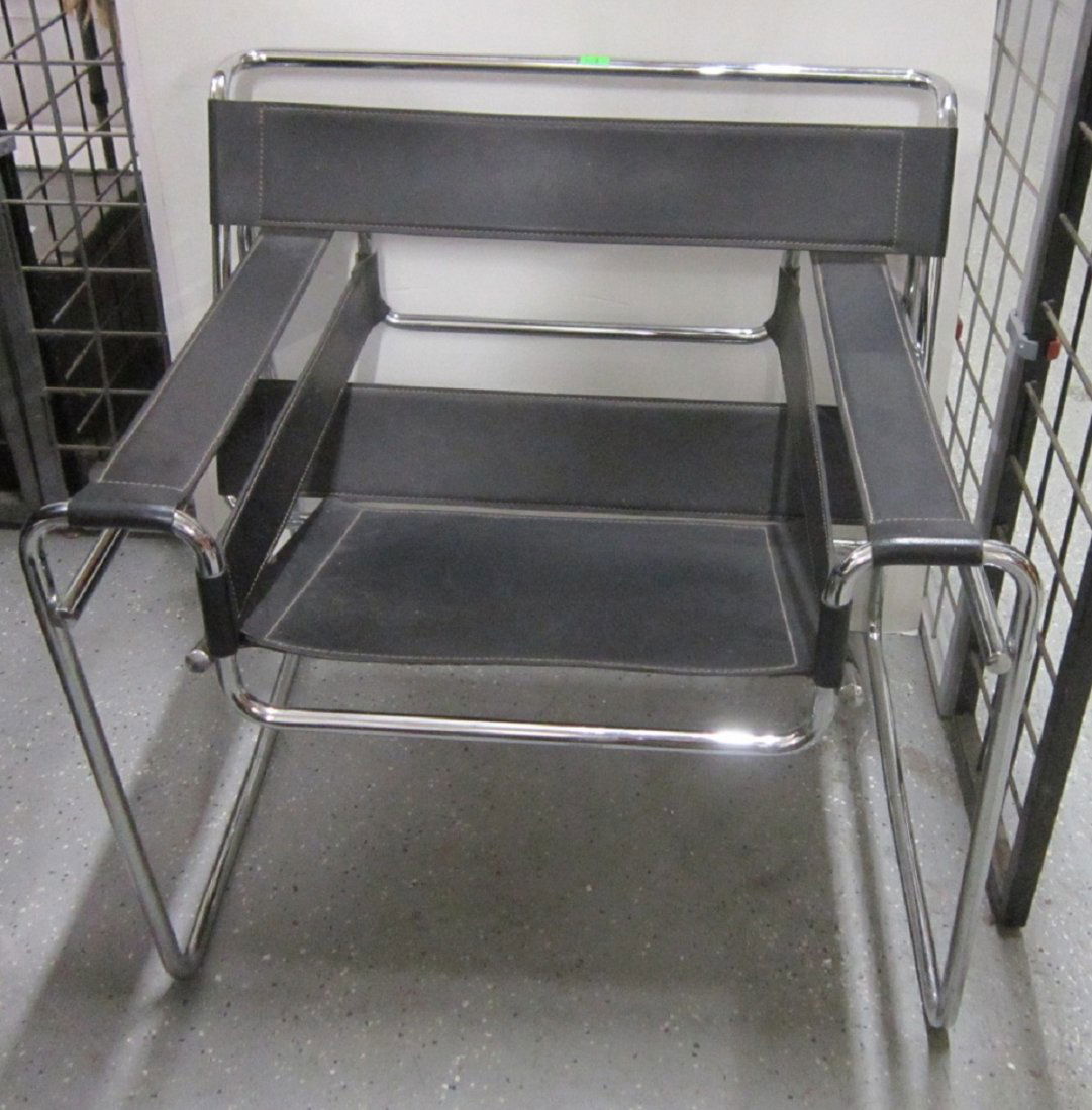 Le Corbusier Type Arm Chair: Le Corbusier Type Arm Chair, polished chrome plated steel tube frame, black leather seat, back and sling arm rests, circa 1970-80s. CONDITION: Good, used condition.
