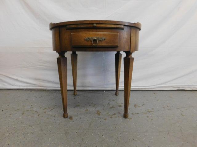 Round Traditional End Table: Round Traditional End Table, walnut, by Wm. A. Berkey Furniture Co., a division of John Widdicomb, partial gallery top over pull out shelf and single drawer, mid 20th c. 22" h. x 23" diam. Condition;