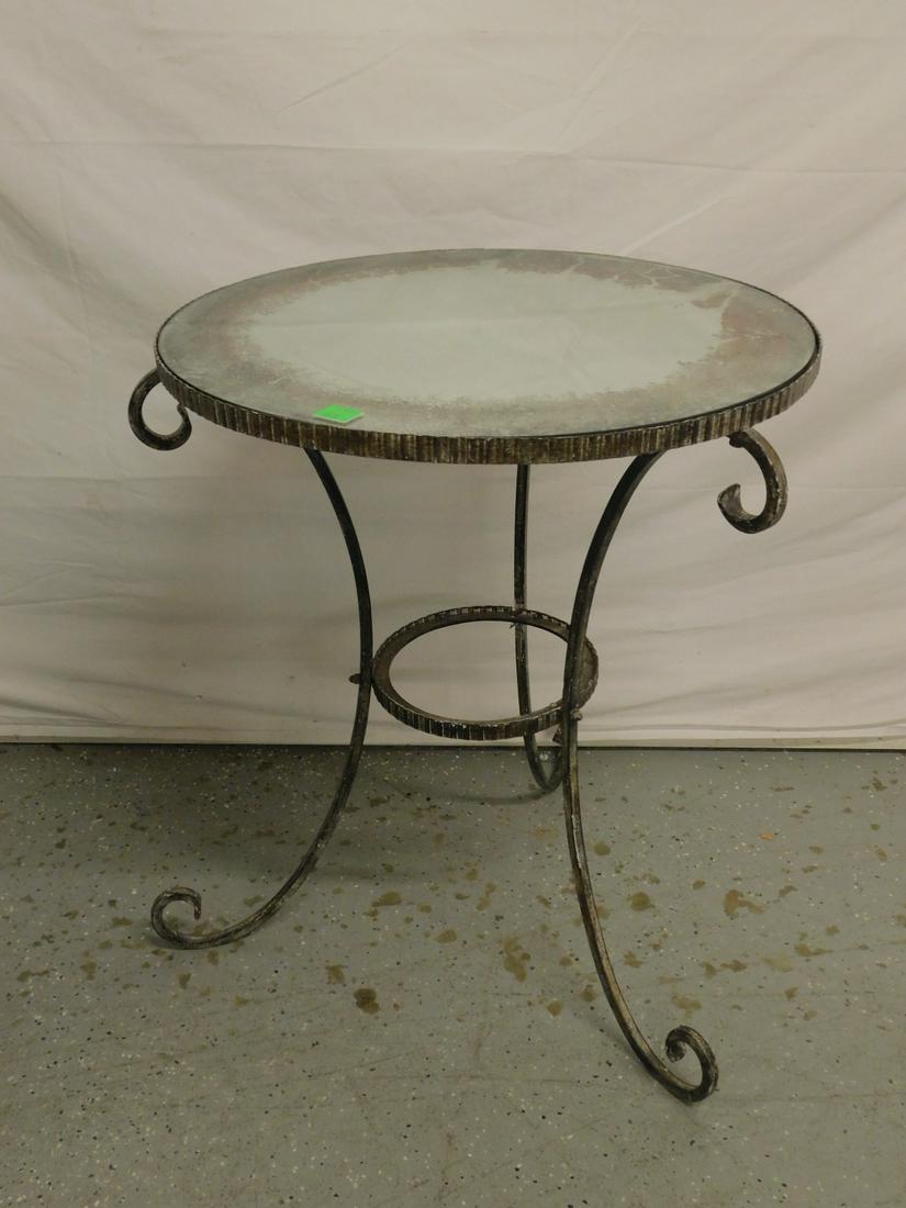Art Deco Center Table: Art Deco Center Table, distressed painted wrought iron with scroll feet, the 23 3/4" d distressed mirrored top is inset into an iron notched border frame, early 20th C. CONDITION: Table needs tighteni