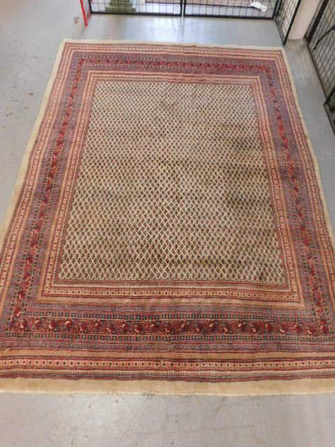 Iran Persian Carpet: Iran Persian Carpet, cream field with an abundance of red and green floral bouquets; diverse group of multi colored and patterned borders, mid 20th C, 147" x 107". [11] CONDITION: Very good, modest we