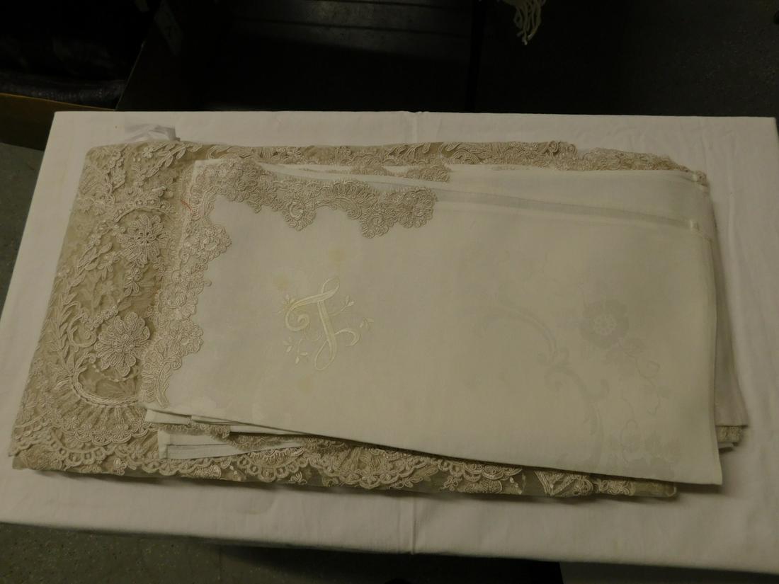 Battenburg Lace Table Cover: Battenburg Lace Table Cover, open work floral design over lace, beige, approx. 67" (5'7") x 76 1/2" (6'6 1/2") with fourteen white linen floral design napkins (monogramed) with one corner applied Batt