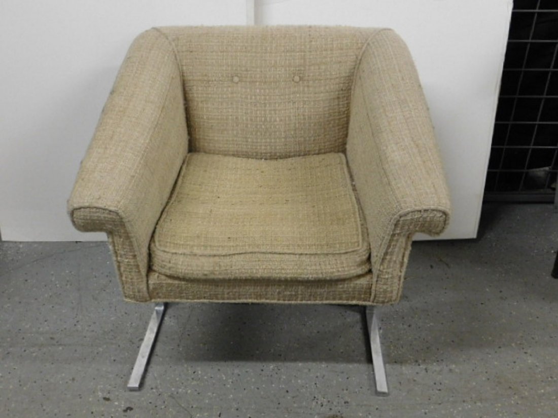 Milo Baughman Style Arm Chair: Milo Baughman Style Arm Chair, polished stainless steel and off white cloth upholstery, cantilevered base, circa 1970s, 26 1/2"h. CONDITION: Very good, original upholstery with light wear.