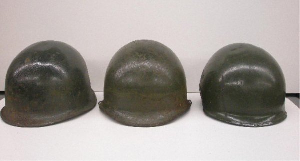 World War II U.S. Military Helmets: Three World War II United States military combat helmets