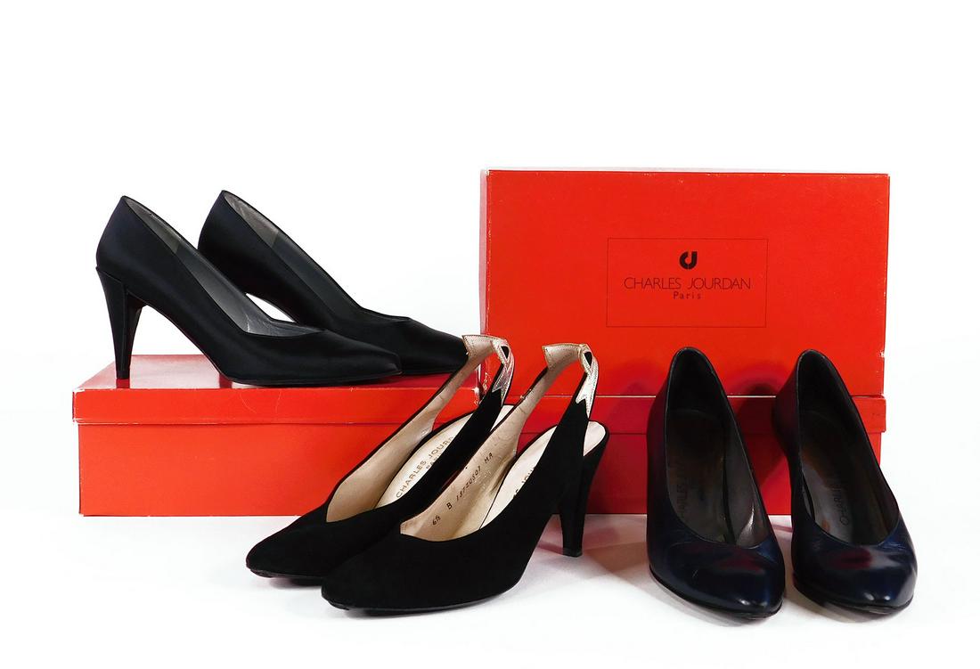Charles Jourdan: Three Pairs Women’s Heels: Three pairs vintage Charles Jourdan women's heels. Comprised of one pair black satin pumps on a nearly 3.5 inch heel, size 7B; one pair black suede slingback pumps with pale gold trimming, 3 inch heel