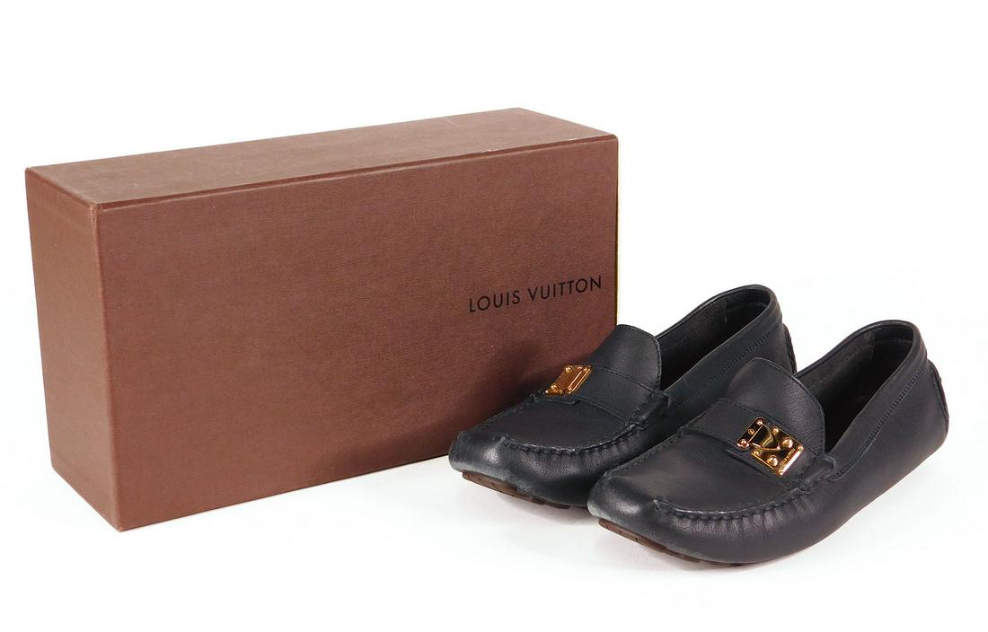 Louis Vuitton: Pair Women’s Driving Loafers: Pair Louis Vuitton women’s driving loafers in navy leather with polished gold hardware. Size 37, in original box with dustbags. Condition: Very good, outsole nearly new, some minor to moderate scuff