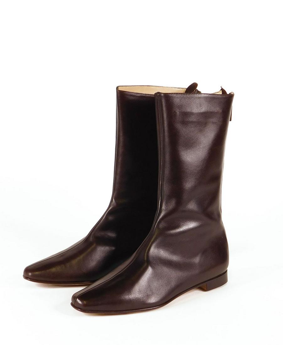 Manolo Blahnik: Pair Women’s Boots and Loafers: Pair Manolo Blahnik women’s “Courri” brown leather calf height boots (11” including low heel), size 37.5. In original box with dustbag. Along with a pair of Manolo Blahnik brown suede tasseled