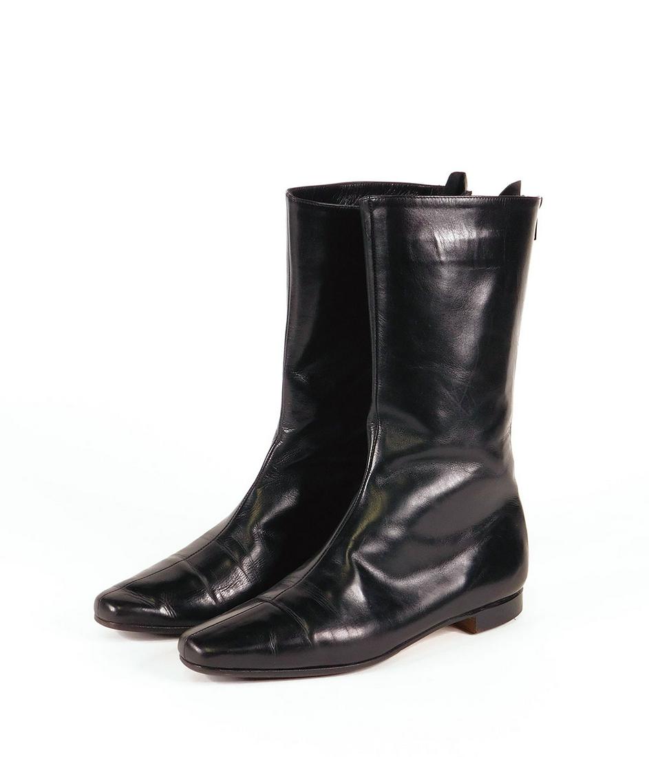 Manolo Blahnik: Pair Women’s Boots: Pair Manolo Blahnik women’s “Courri” black leather calf height boots (11” including low heel), size 37. In original box with dustbag. Condition: Very good, minor to moderate wear.